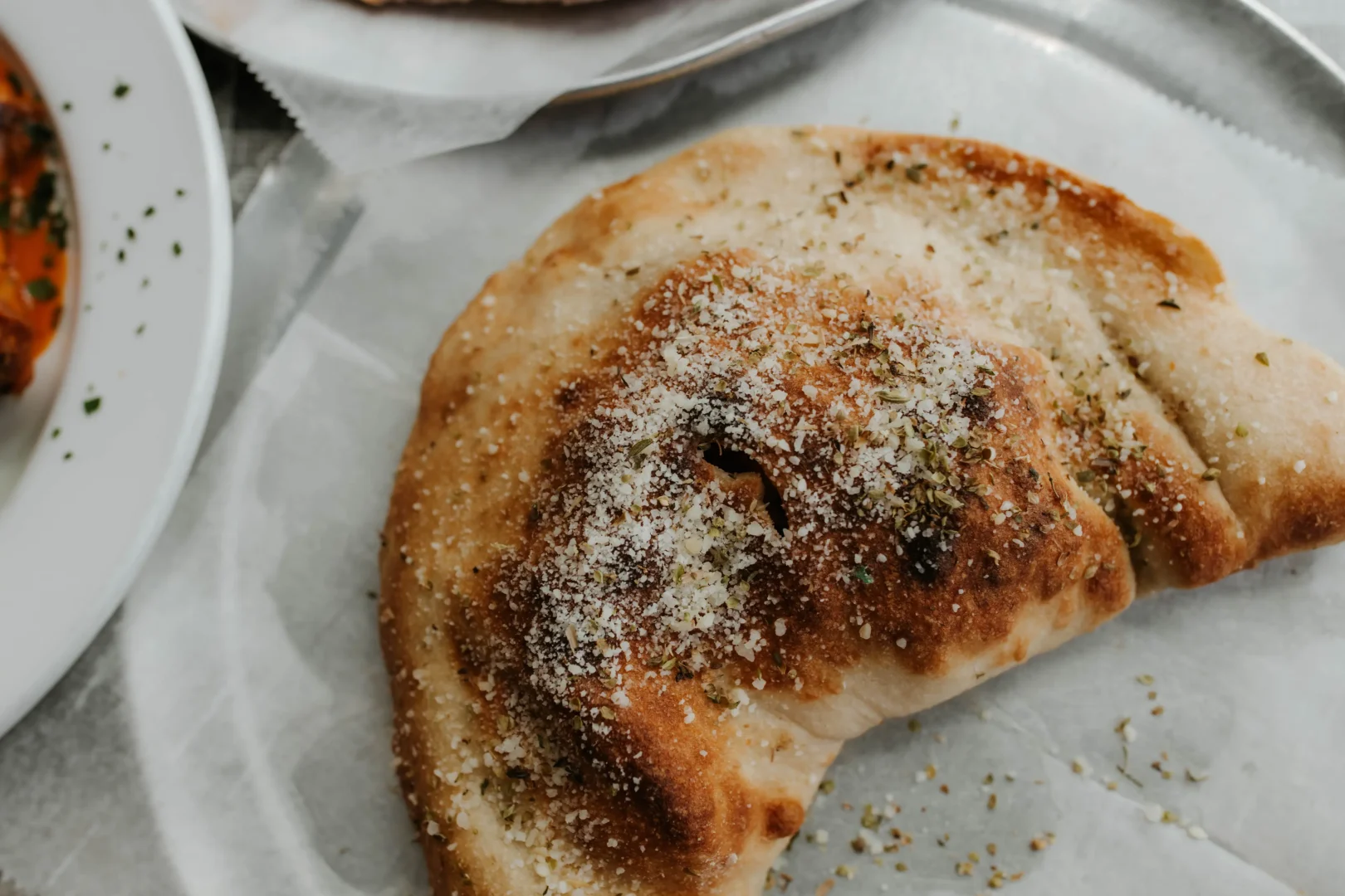 Calzone on table at Buckhead Pizza Co. in Atlanta, Ga
