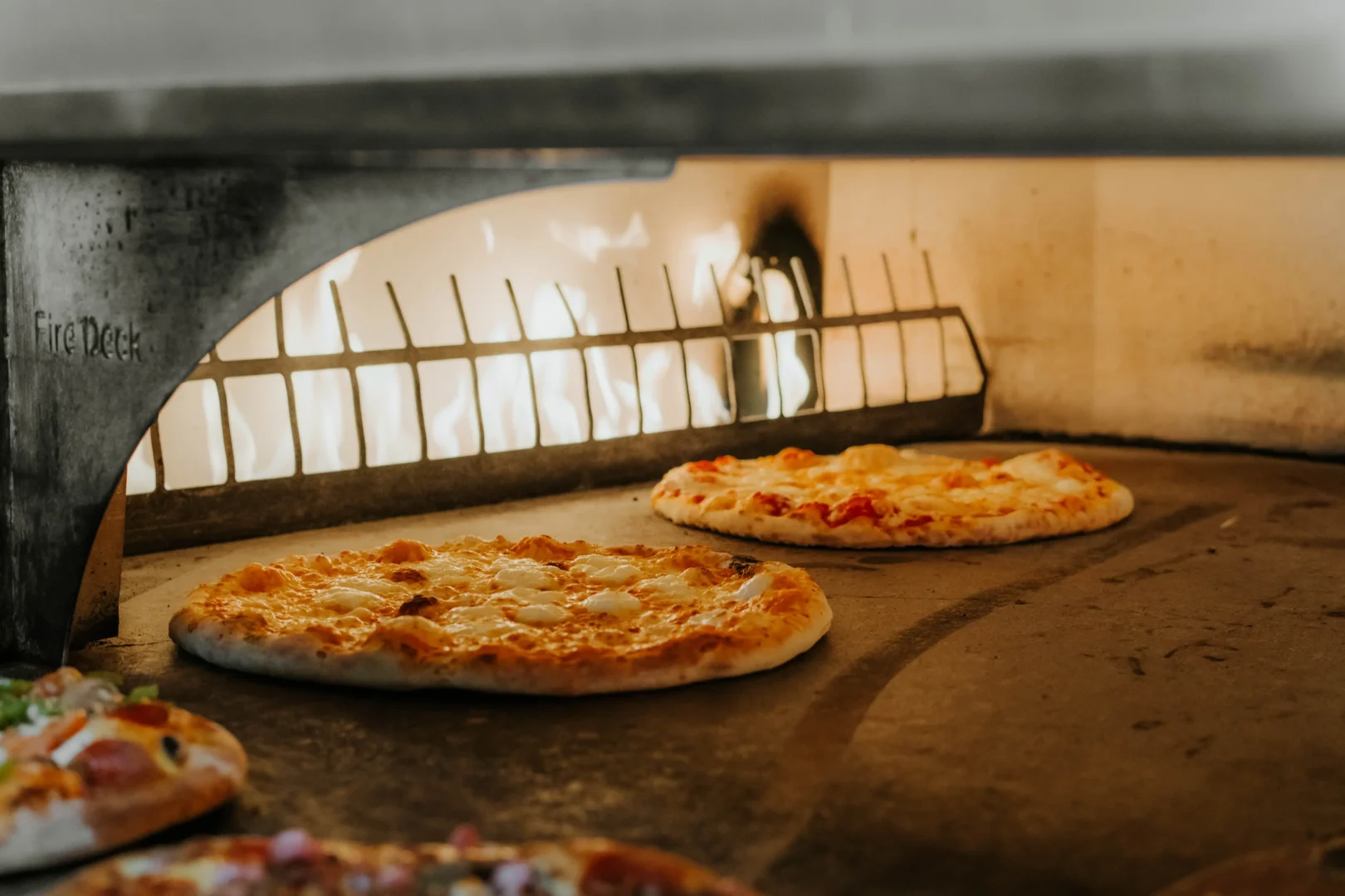 Multiple pizzas in oven at Buckhead Pizza Co. in Atlanta, Ga